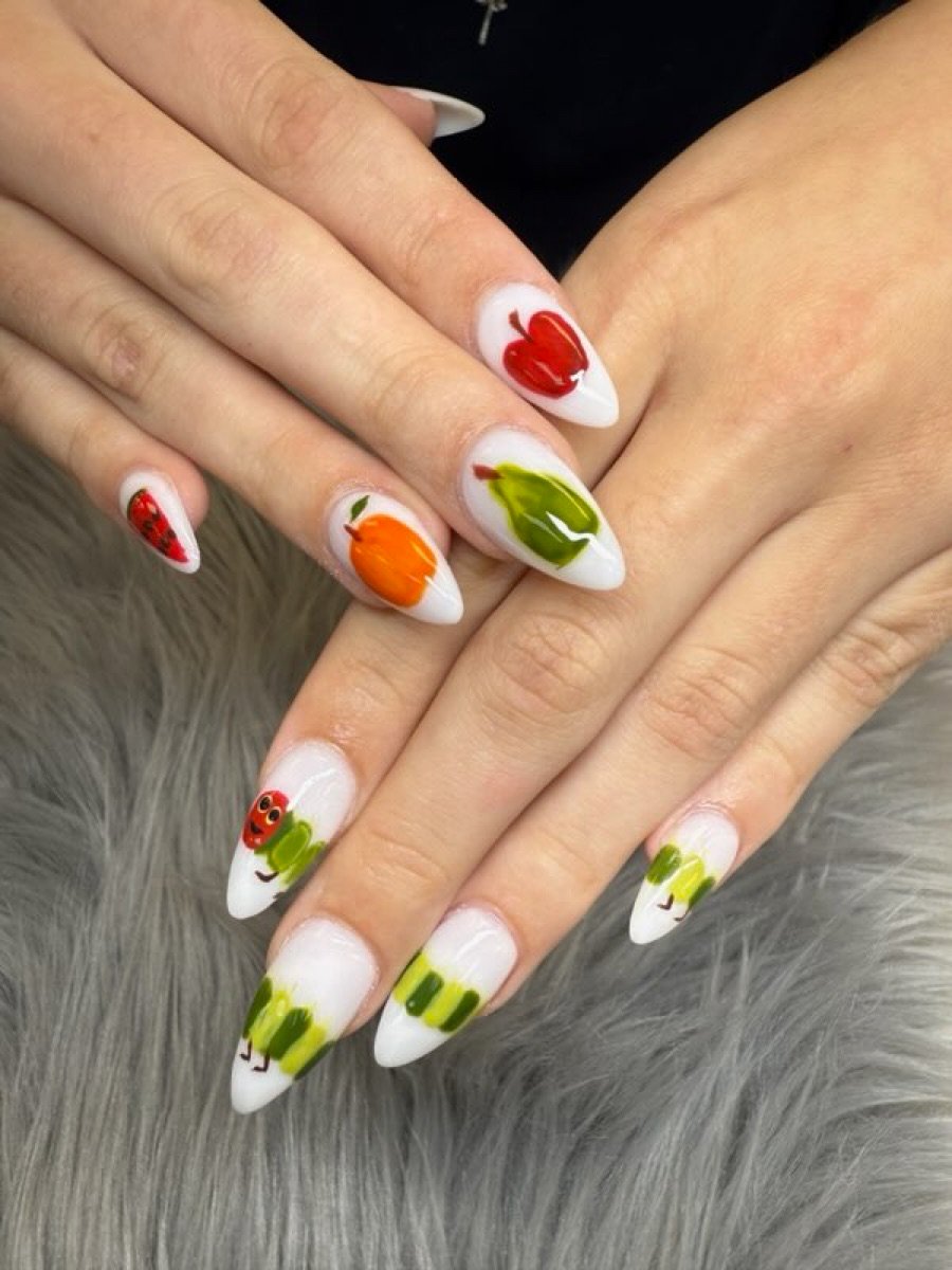 Hand painted garden themed nail set done at Color Nails Club